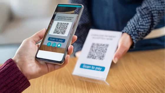 Person scanning a QR code to pay